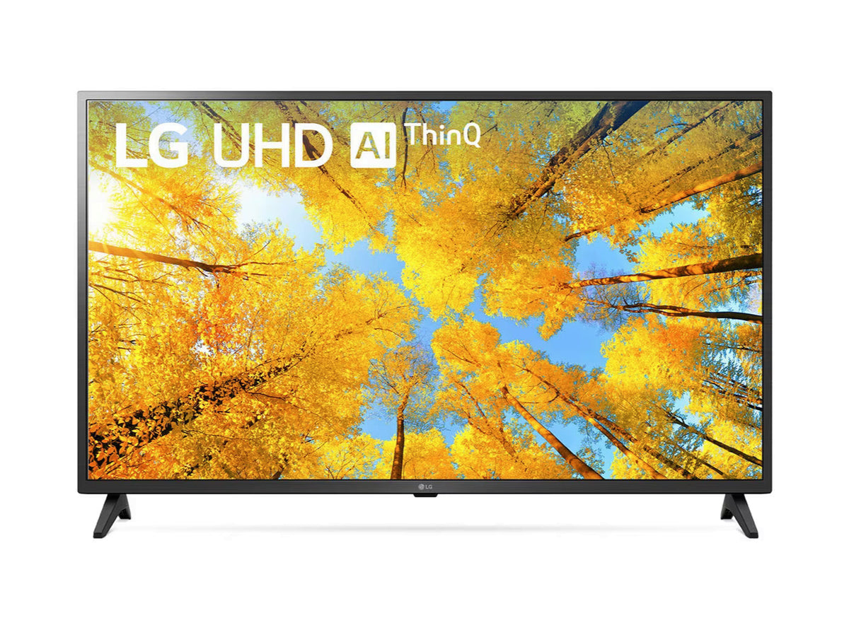 LG 65UQ7500 4K Smart TV előlnézetben, talpon. A kijelzőn őszies sárga levelű fák és lg uhd thinq ai logó.
