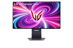 LG 32GS94UX-B Monitor előlnézetben talpon. A kijelzőn lg ultragear oled logó és kékes lila absztrakt fénycsóvák.