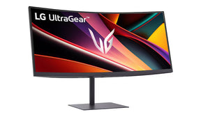 LG 34G630A-B Monitor előlnézetben talpon, enyén jobbra fordítva és felfelé néz. A kijelzőn zöldes piros absztrakt ábra lés ultragear logó.