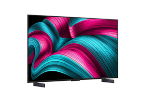 LG 42C5 OLED Televízió előlnézetben, talpon, enyhén jobbra fordítva. A kijelzőn pirosas kék absztrakt ábrák.