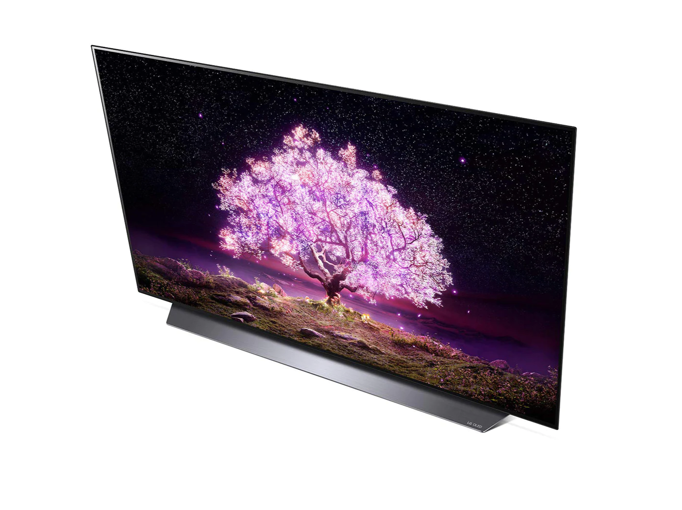 LG 48C1 OLED televízió fentről nézve talpon, a kijelzőn csillagos égbolt és rózsaszínben világító fa.
