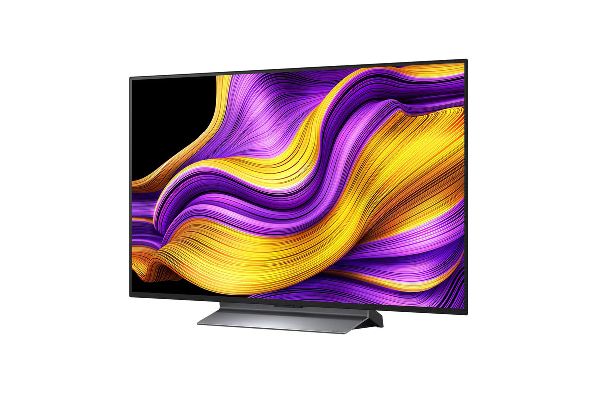 LG 48G5 OLED Televízió előlnézetben, talpon. A kijelzőn sárgás lila absztrakt ábra.
