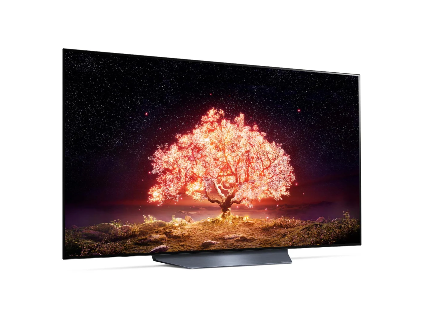LG 55B1 OLED televízió előlnézetben enyhén jobbra fordítva talpon, a kijelzőn csillagos égbolt és narancssárgán világító fa.