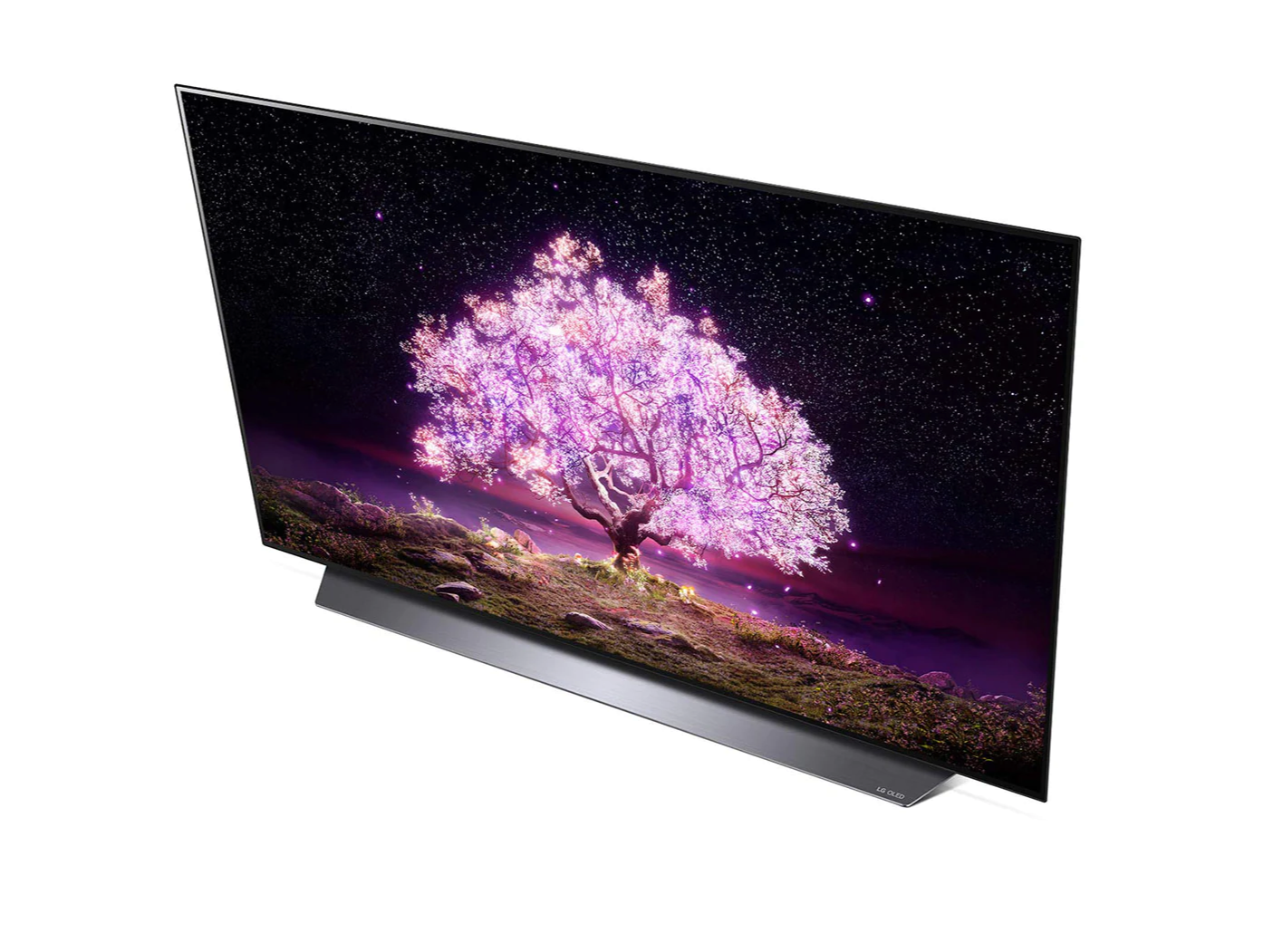 LG 65C1 OLED televízió fentről nézve talpon, a kijelzőn csillagos égbolt és rózsaszínben világító fa.