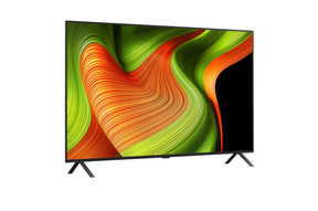 LG 83B5 OLED Televízió előlnézetben talpon, enyhén jobbra fordítva. A kijelzőn zöldés sárga absztrakt ábra.