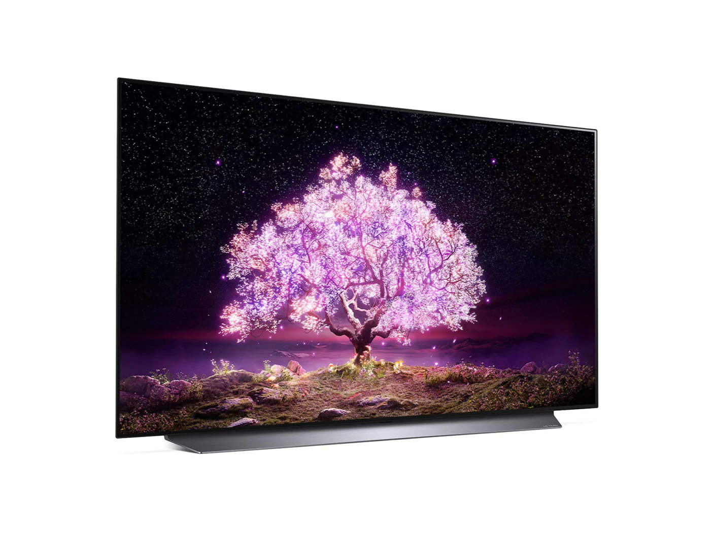 LG 83C1 OLED televízió előlnézetben enyhén jobbra fordítva talpon, a kijelzőn csillagos égbolt és rózsaszínben világító fa.