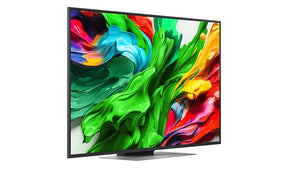 LG 86QNED9MA3B televízió előlnézetben talpon, jobbra fordítva. A kijelzőn színes festékek kavarognak.
